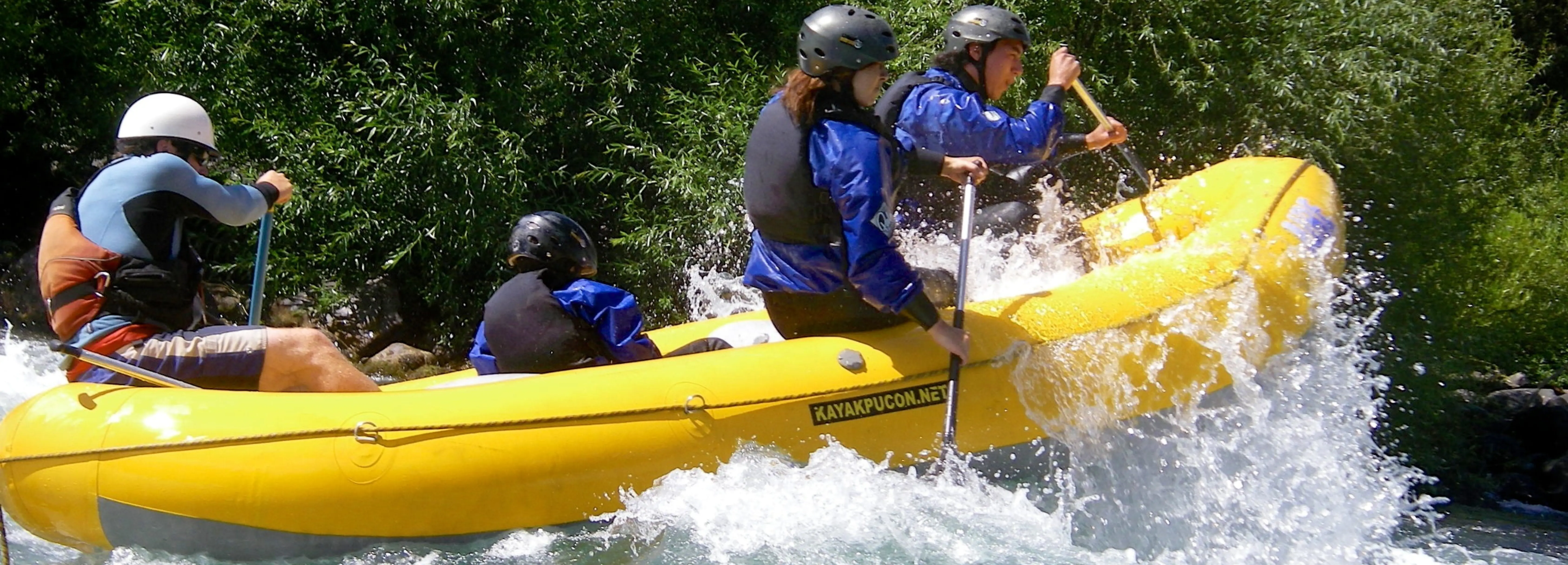 Adventurers conquering thrilling rapids during a 24 km river rafting expedition in Rishikesh.